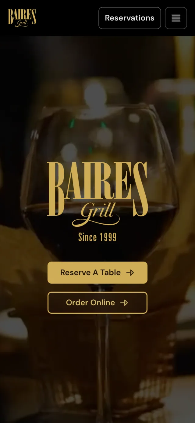 Home page of bairesgrill.com on a phone