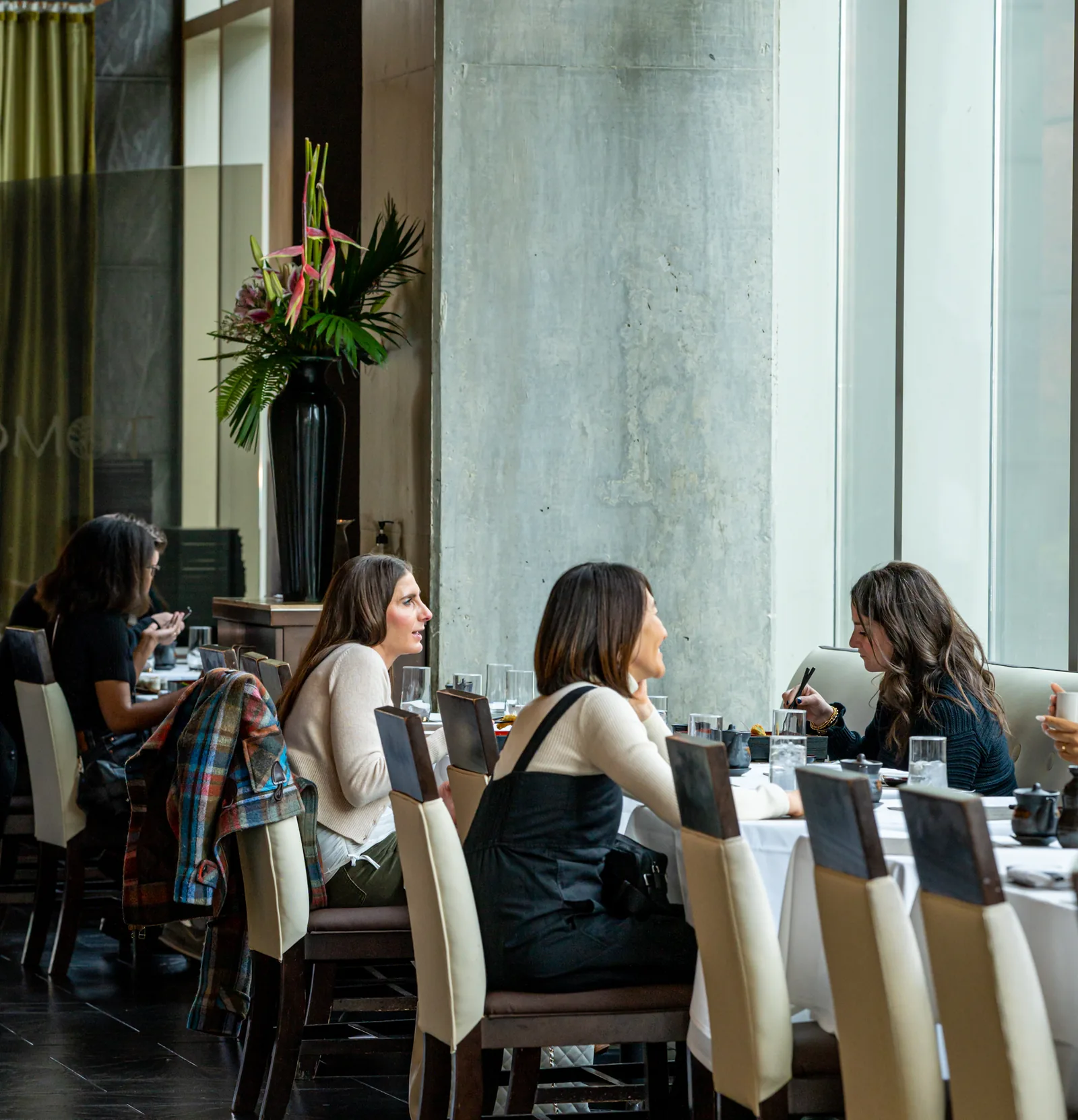 Guests dining by the windows at Tomo Japanese