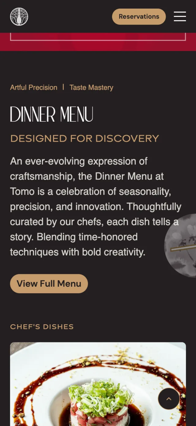 Dinner menu section of the home page of tomorestaurant.com on a phone