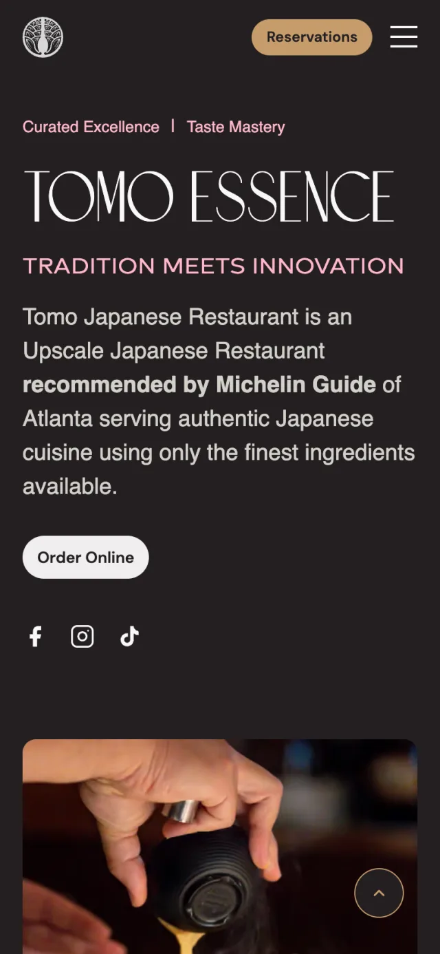 Tomo Essence section of the home page of tomorestaurant.com on a phone