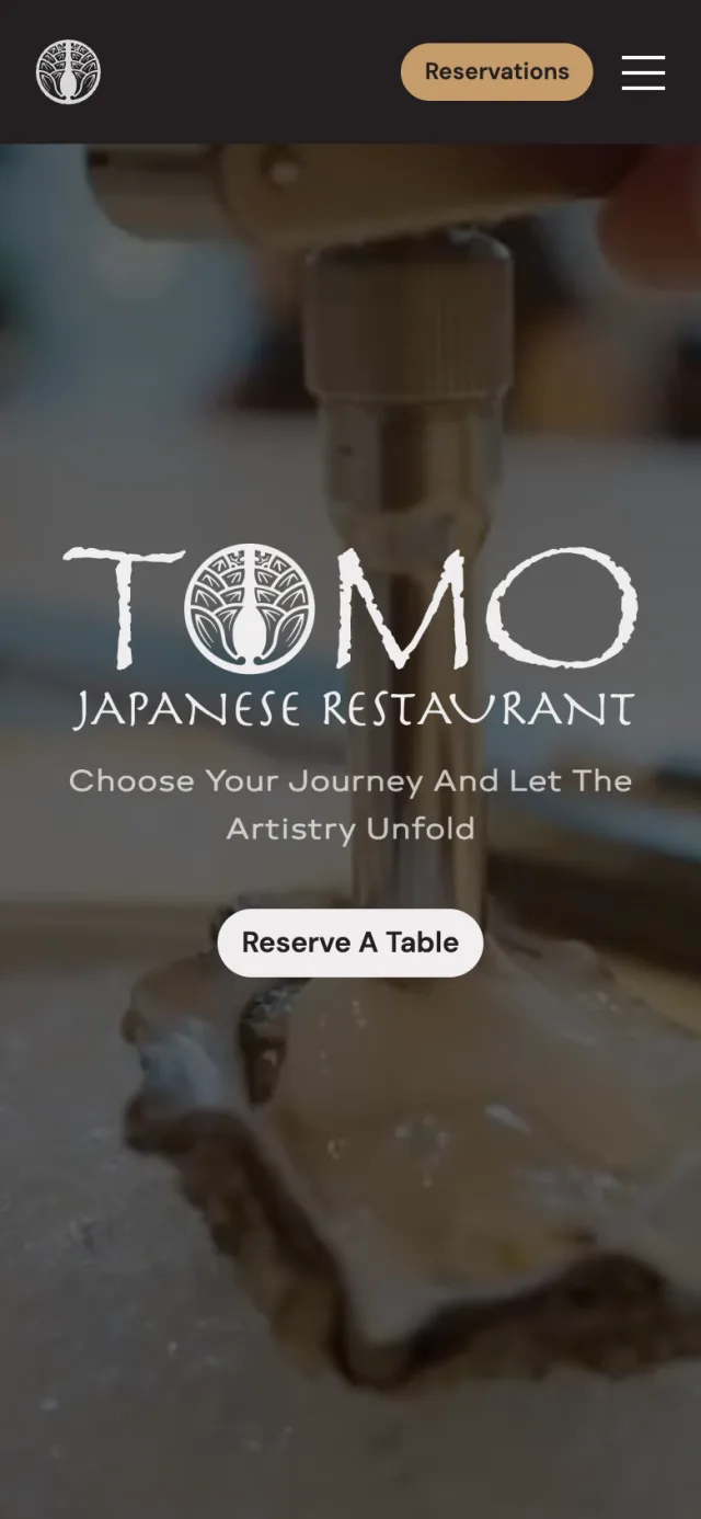 Home page of tomorestaurant.com on a phone