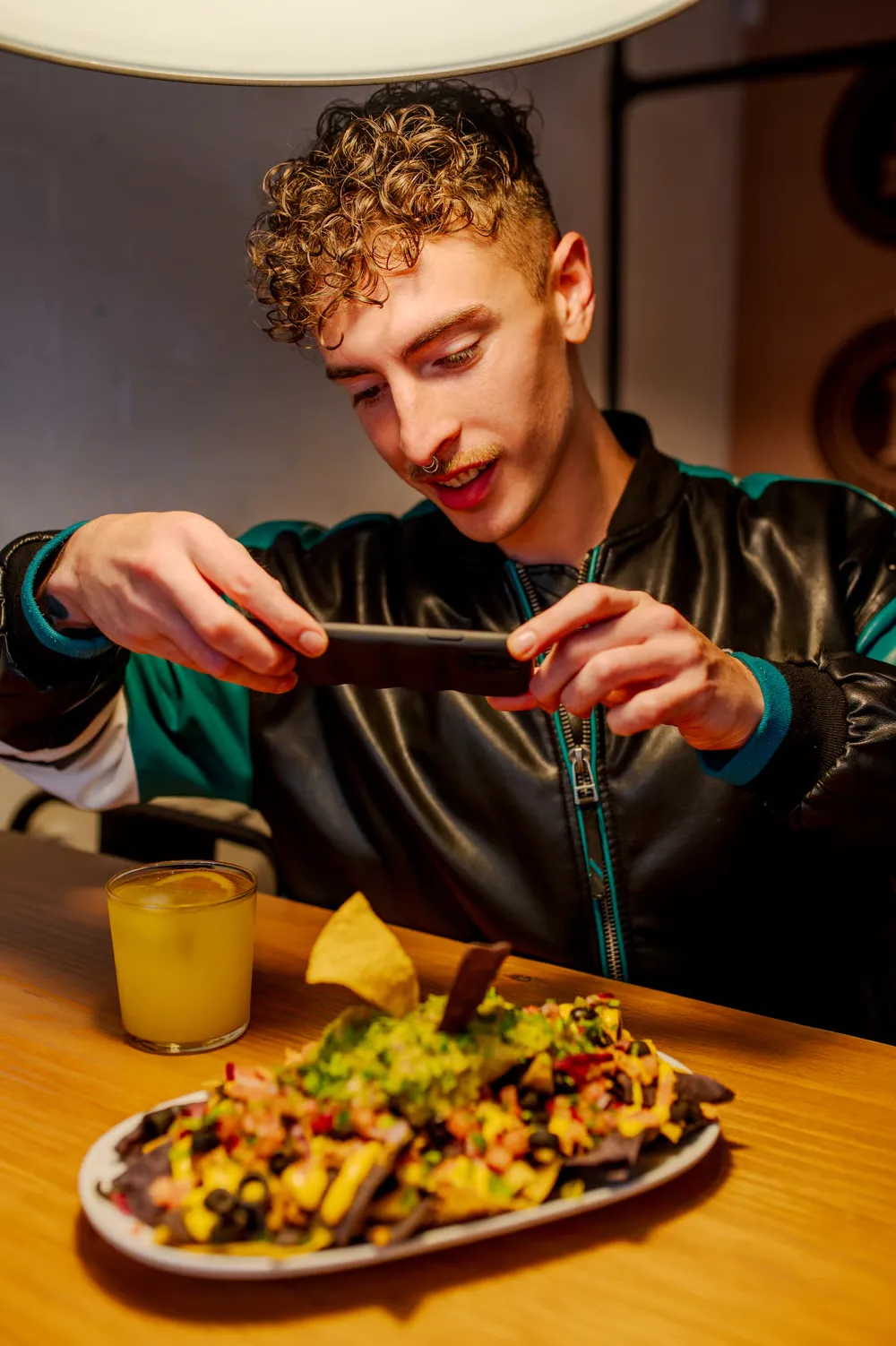 Local creator filming inside a restaurant kitchen